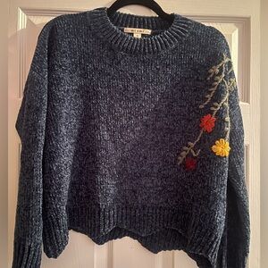 Knit boutique sweater with embroidery detail